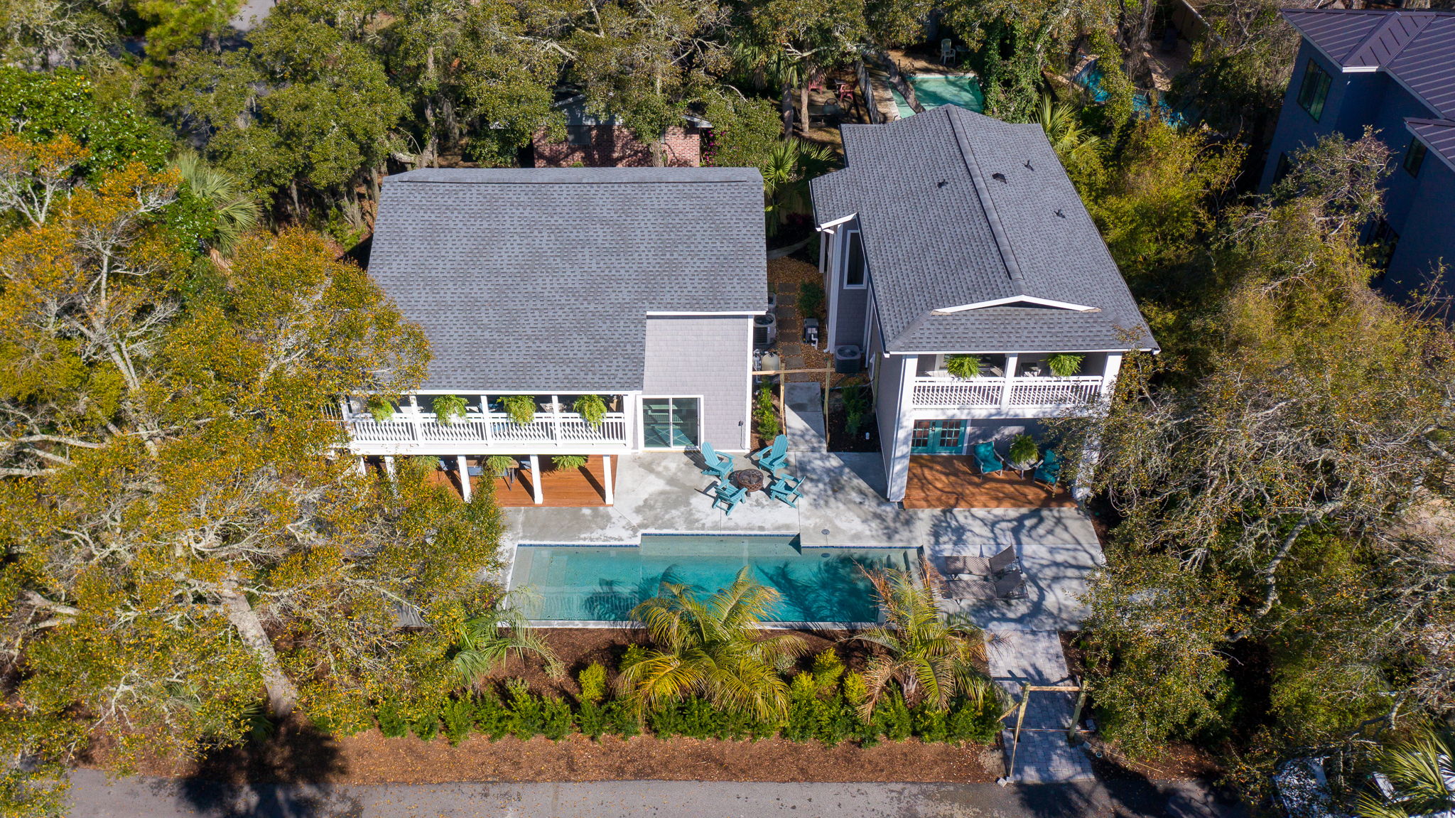 Luxury beach home at 7 Cassina Lane with lush landscaping and ocean glimpses